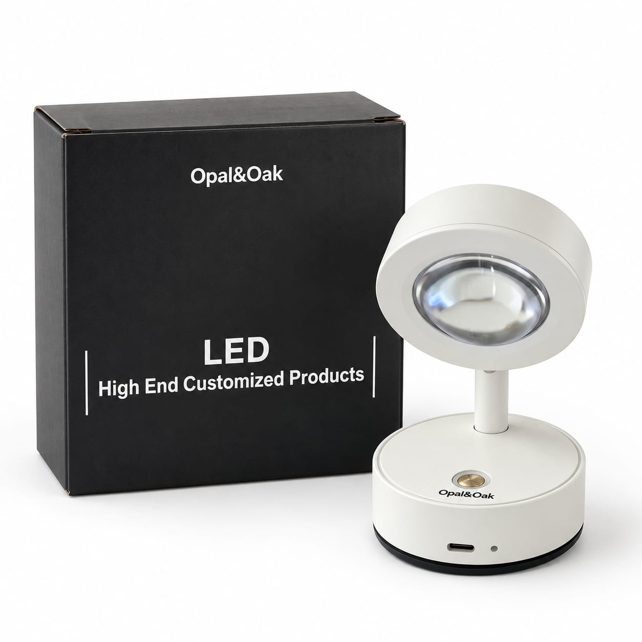 The white spotlight standing beside the box it is supplied in, the Opal&Oak name printed across the top of the box front